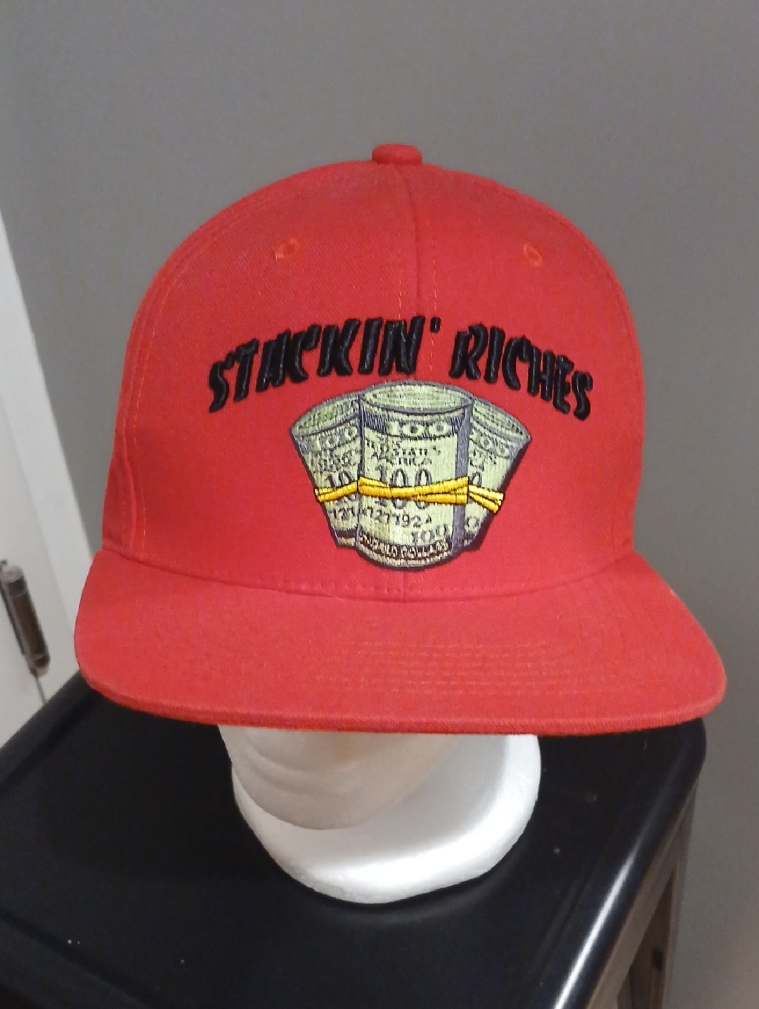 Red Snapback Hat With Embroidered Money Graphic